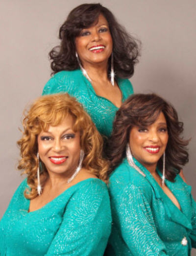The FLOS trio in teal glamour outfits, Scherrie Payne and Lynda Laurence